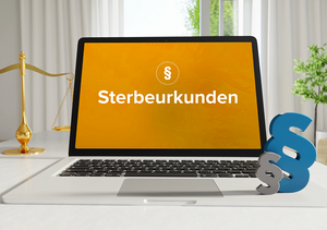 Ein Laptop zeigt den Begriff Sterbeurkunde an